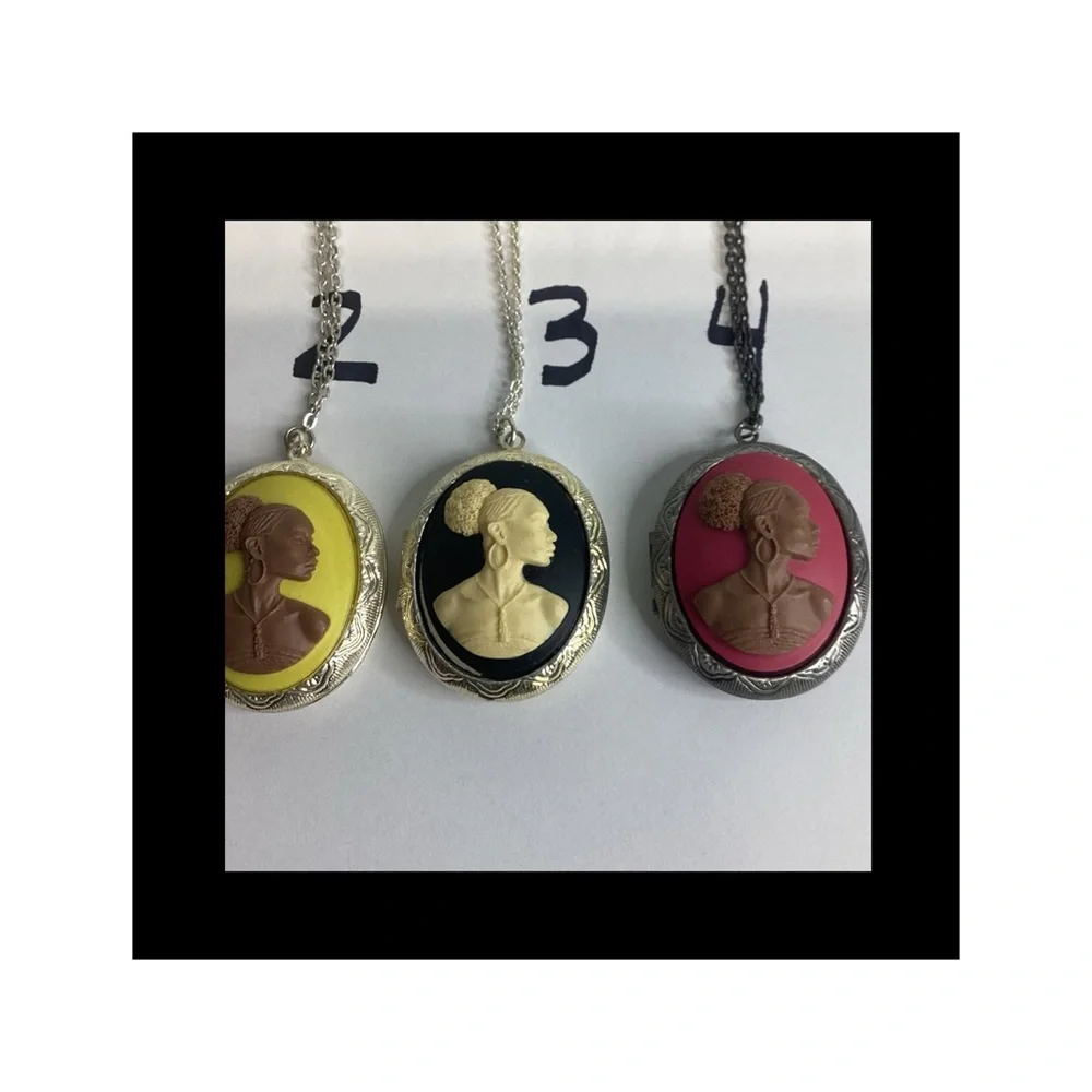 Multicolor raised cameo locket.